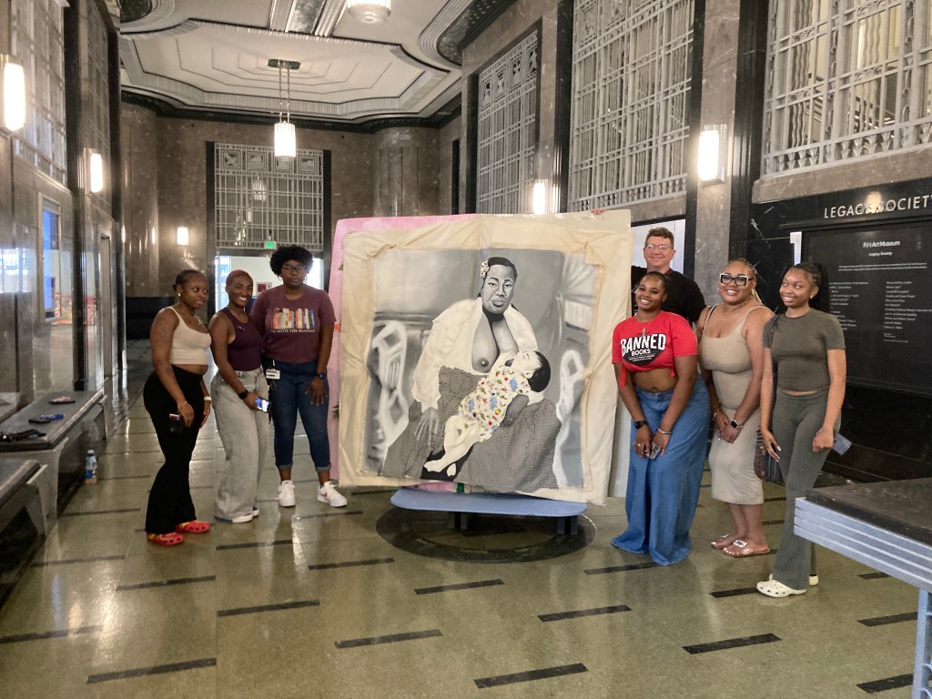 TSU Prof Mike MItchell's Social Practice class with their book at the Frist Museum, Nashville.